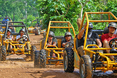 Buggies going down dirt path Barvaro Beach
